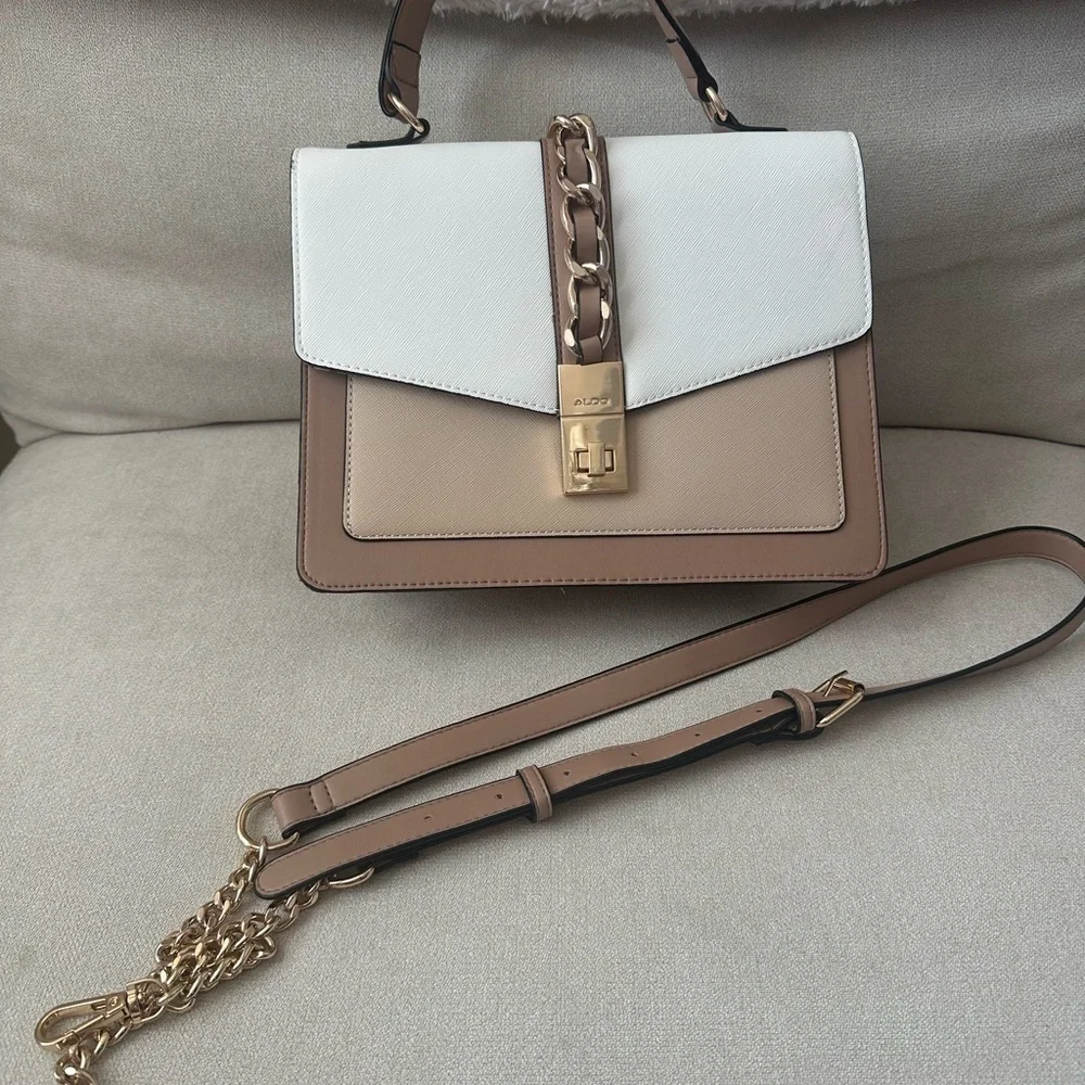 ALDO women's handbag with a top handle and chain detail.